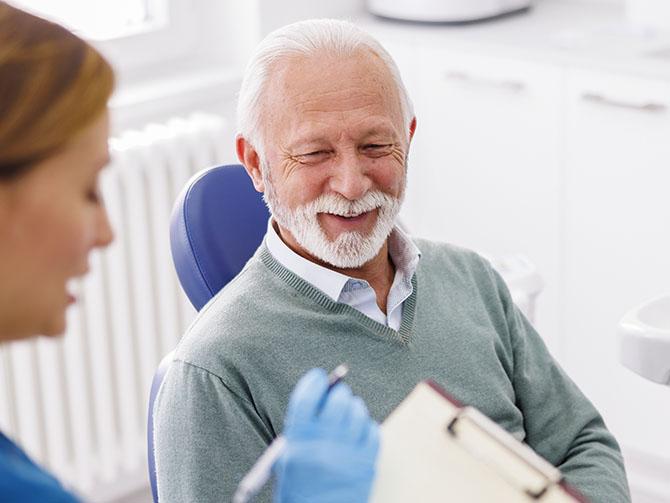 Consulting with dental patient